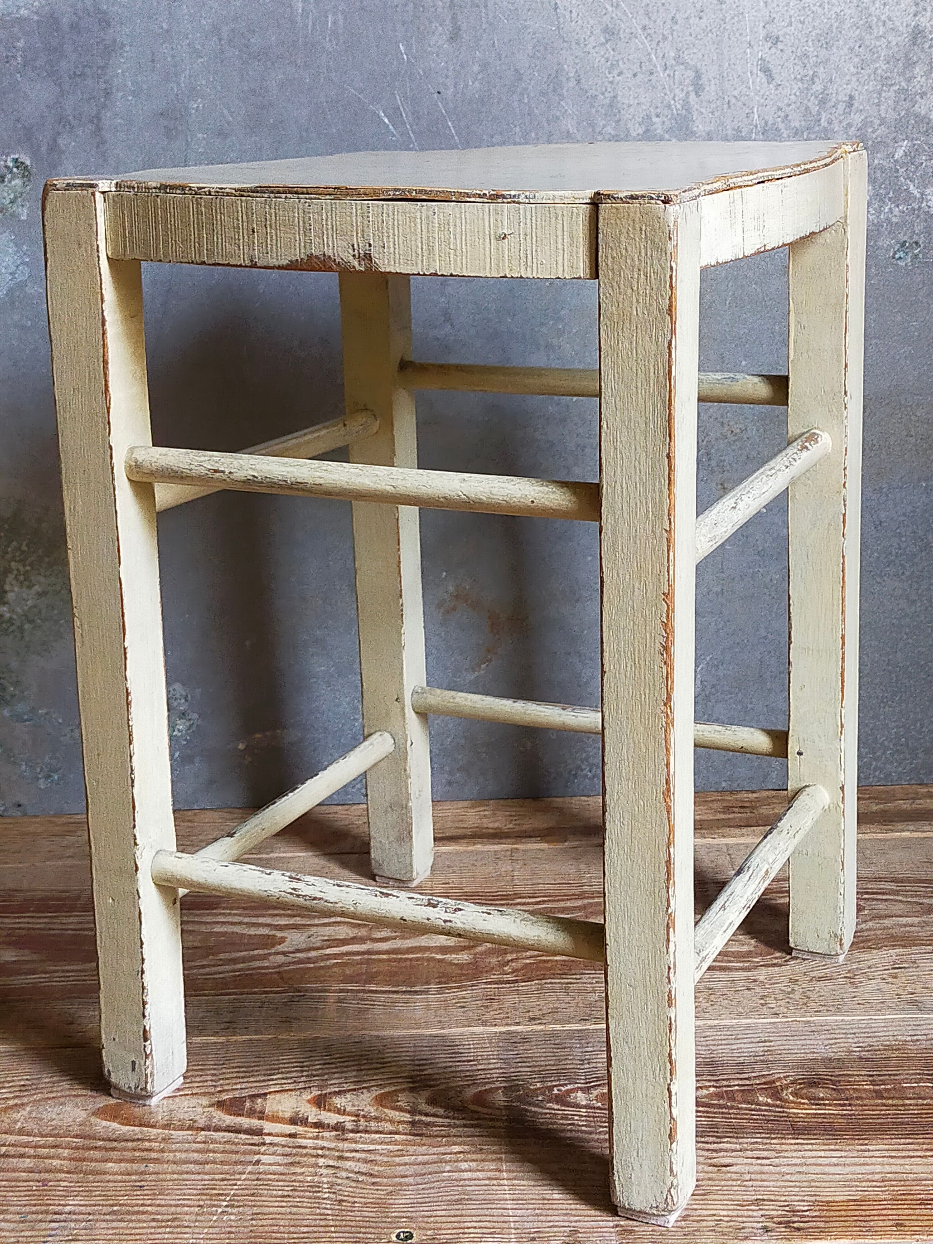 Old patinated painted wooden stool