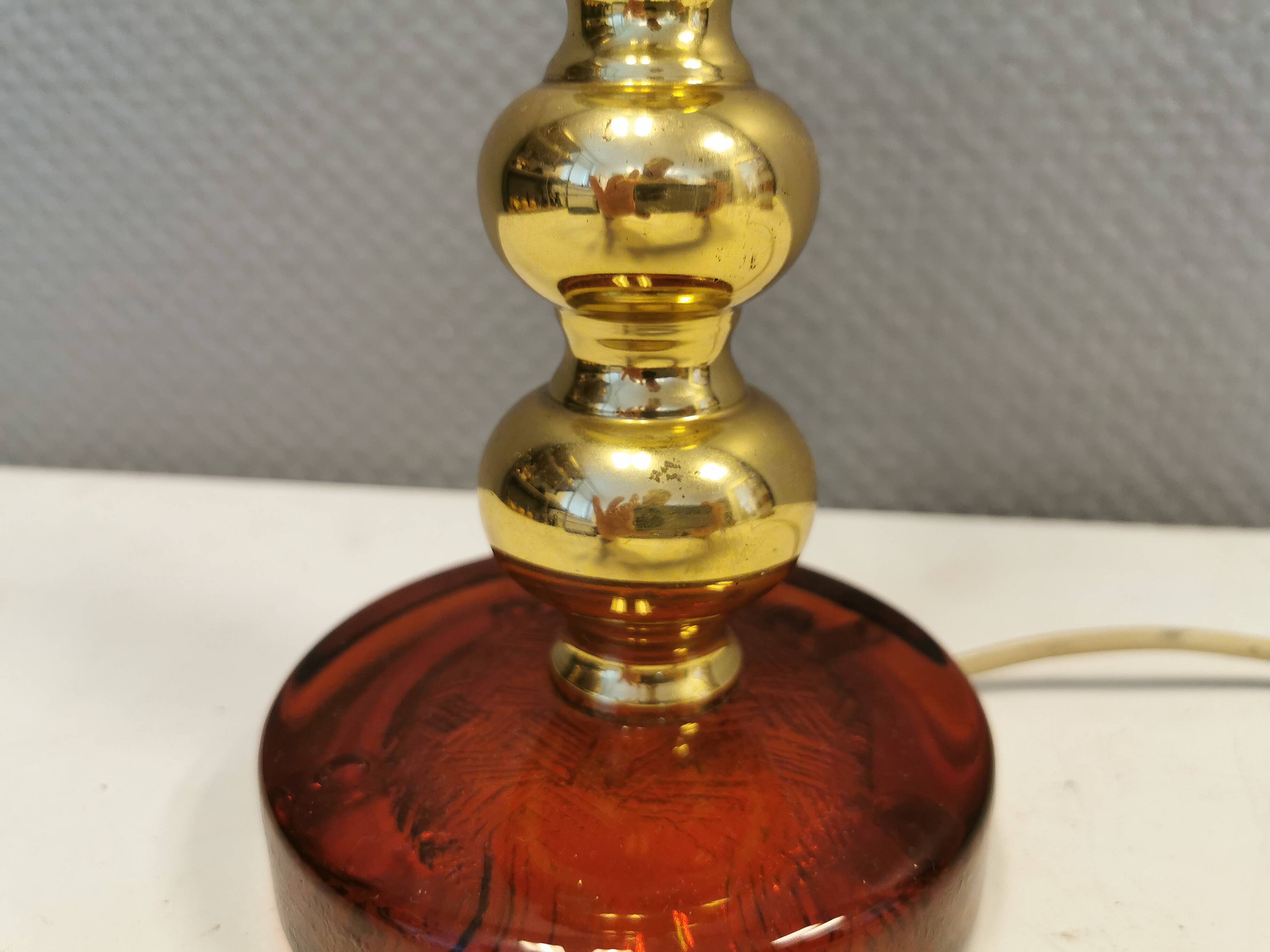 Table lamp from Danish Vitrika in brass, amber colored hard pressed glass, with a shade holder.