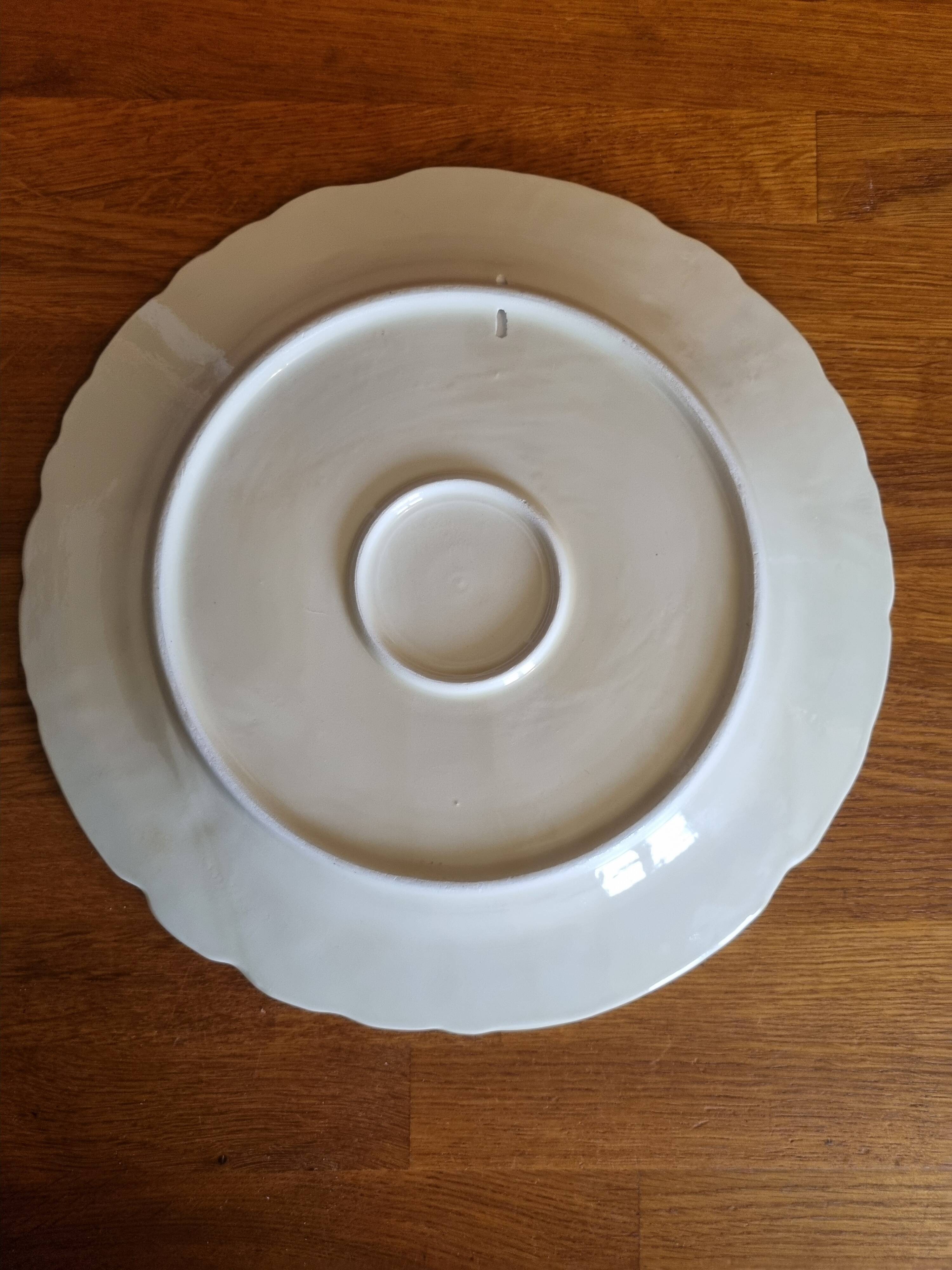 Large vintage earthenware dish with a fruit pattern.