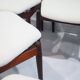 Set of six hardwood chairs by Arne Vodder for Sibast with white textile upholstery.