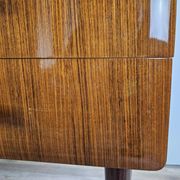 Mid-century drawer chest in mahogany, brass and glass.