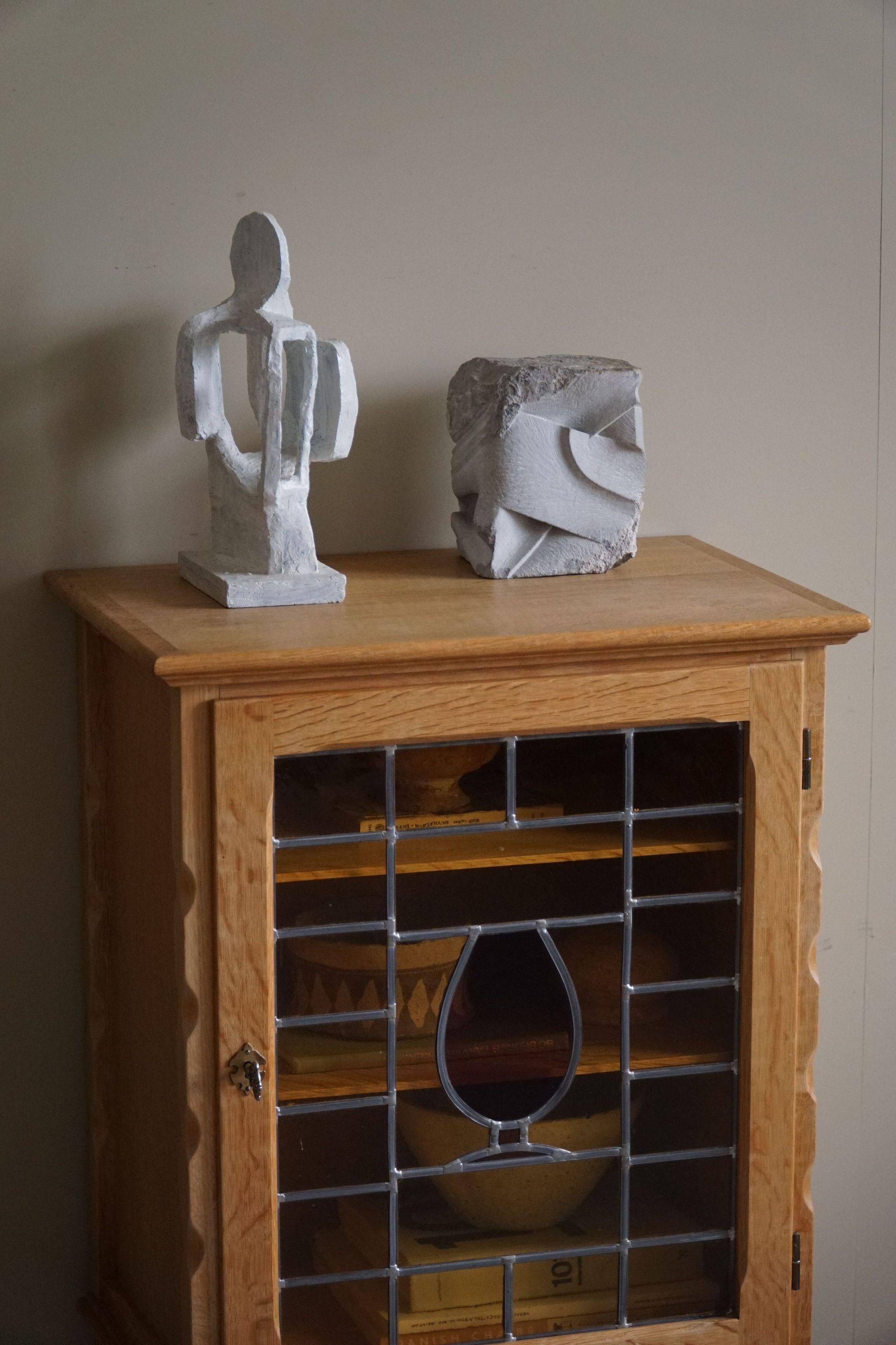 Scandinavian wardrobe in natural oak with a glass front.