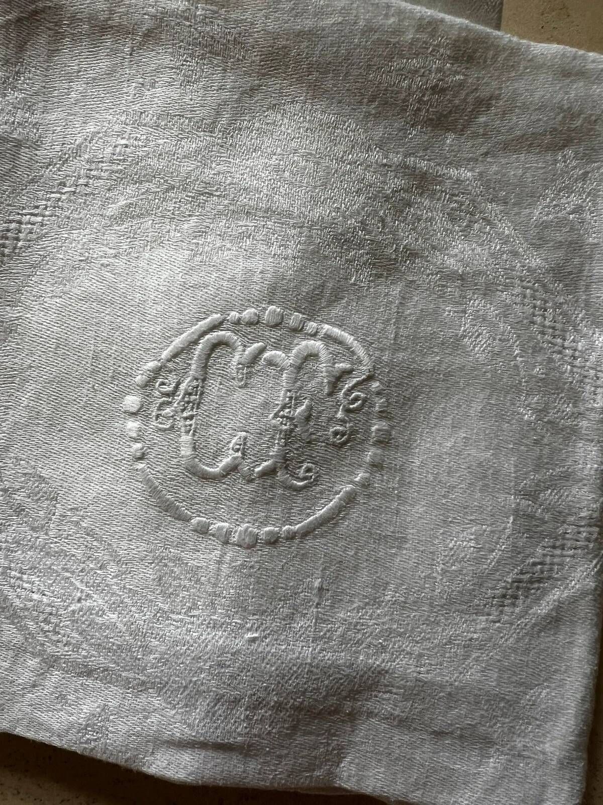 Set of six antique damask napkins with embroidered monogram.