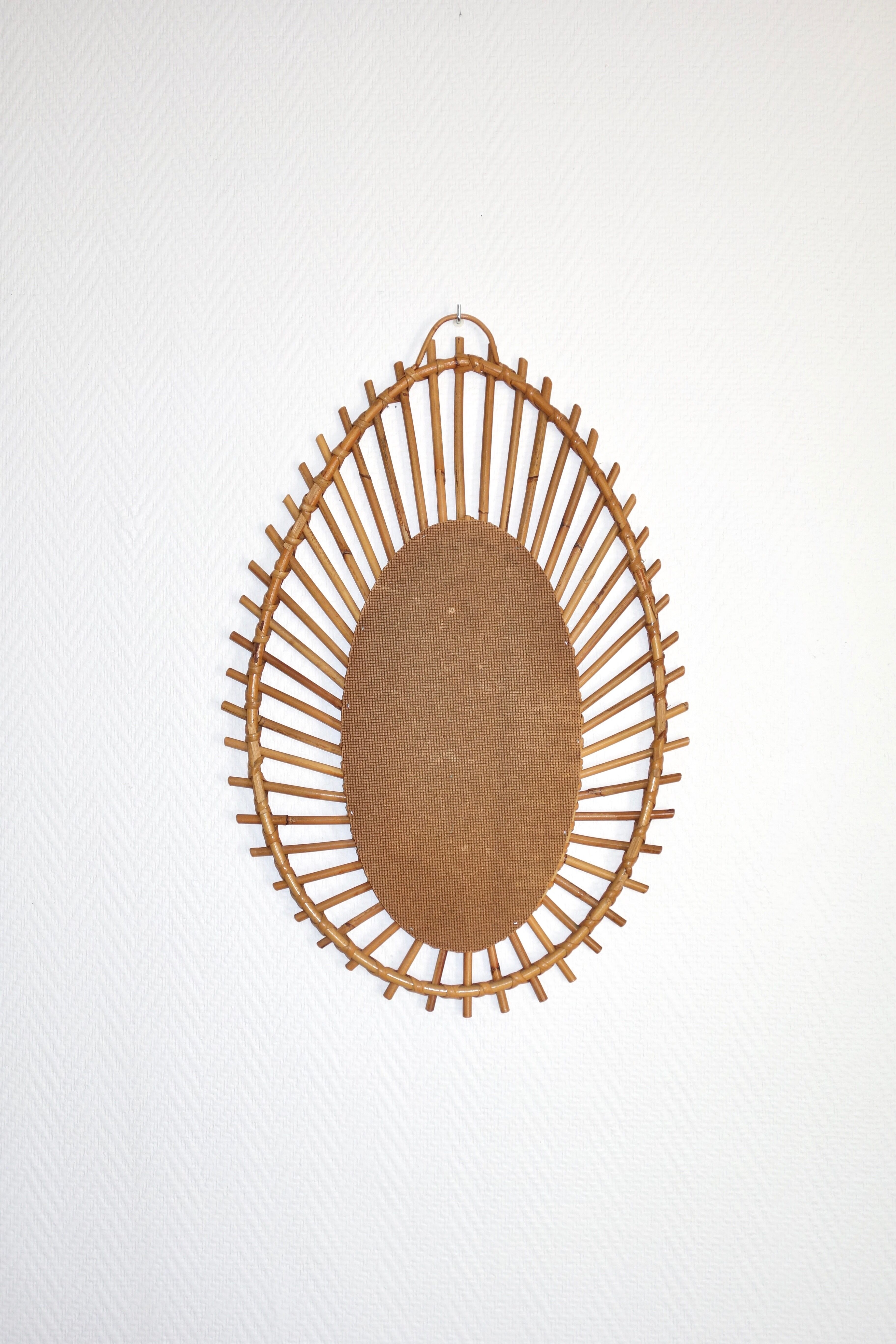Free-form sun mirror in 60s rattan