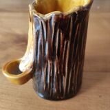 Ceramic vase with tree trunk decoration