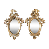 Pair of gilded rococo mirrors in carved wood