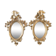 Paire de miroirs rococo dorés en bois sculpté