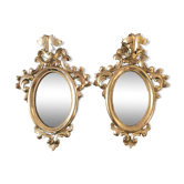 Pair of gilded rococo mirrors in carved wood