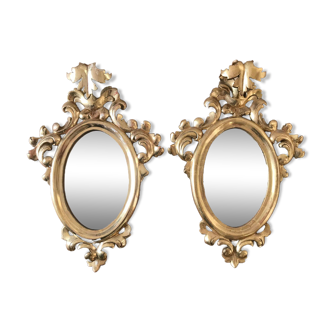 Pair of gilded rococo mirrors in carved wood
