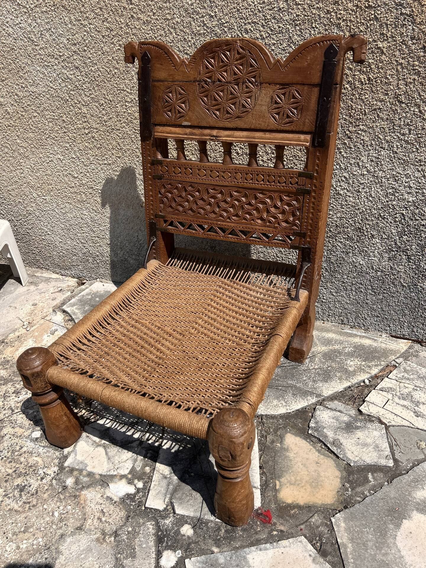 Antique ethnic chair in carved wood