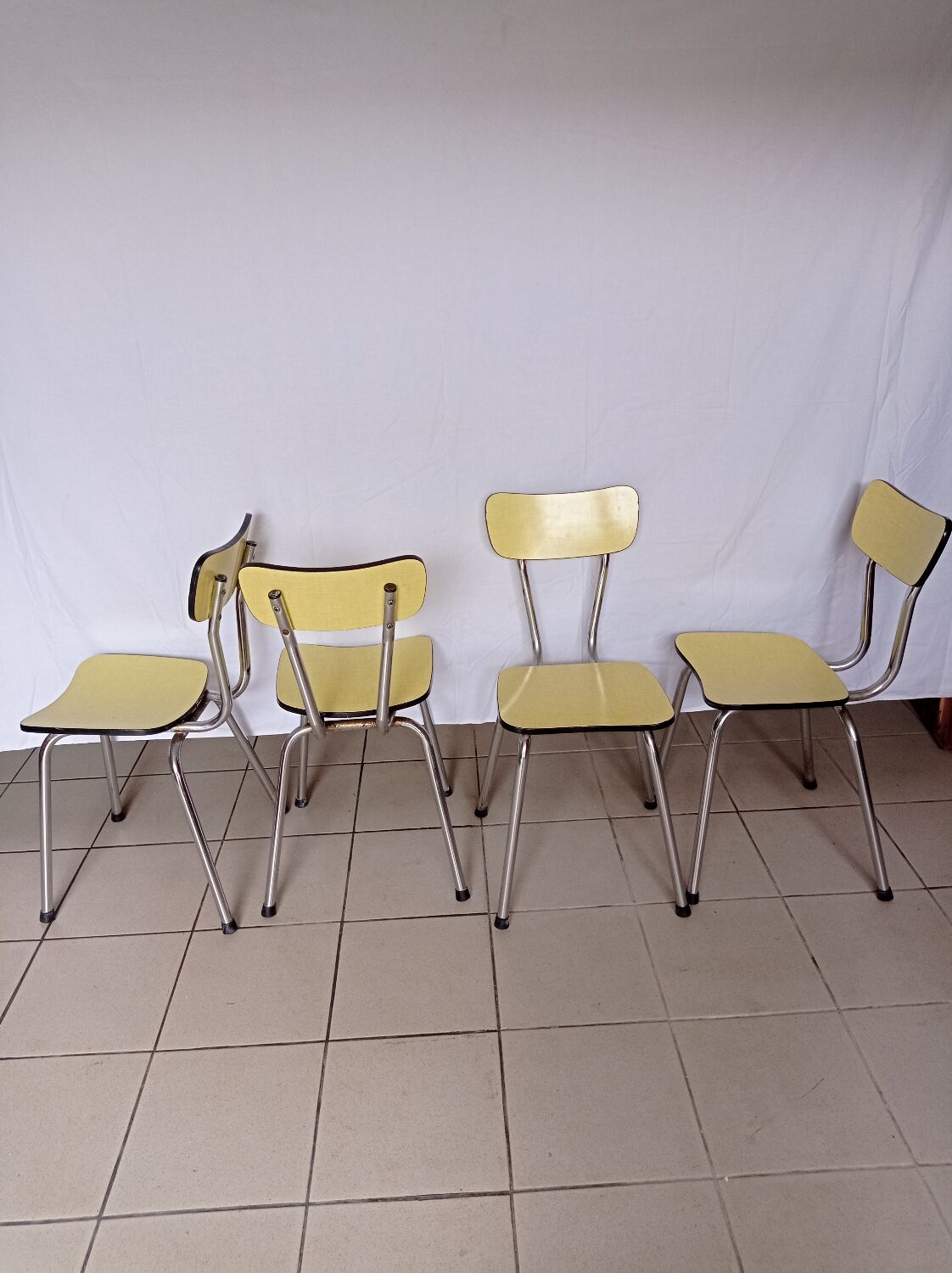 4 yellow Formica chairs