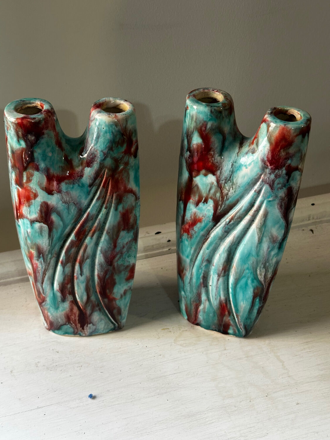 Vintage pair of turquoise and red ceramic candlesticks