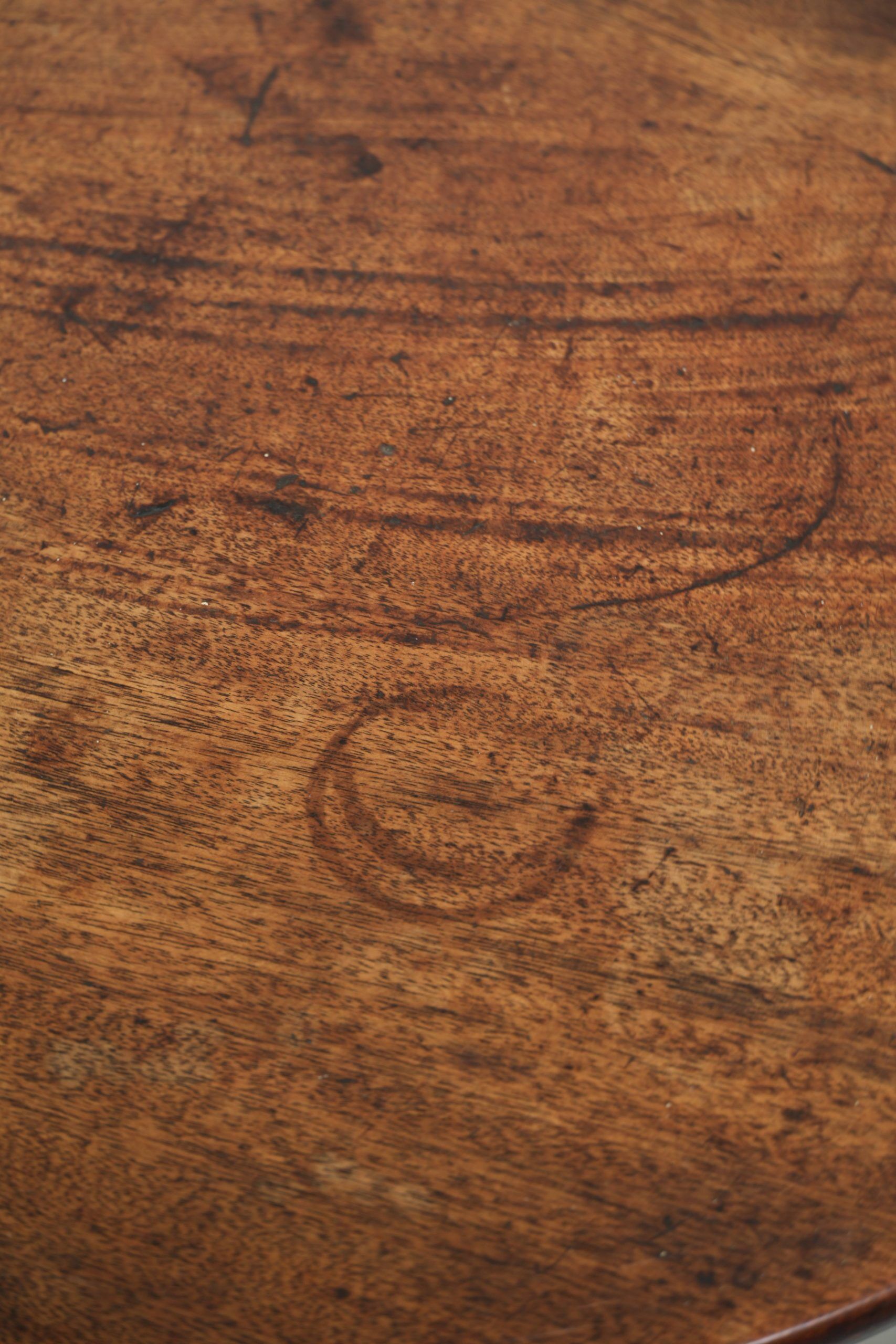 Round antique side/wine table from the late 18th century with a subtle foot
