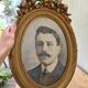 Antique medallion frame in gilded stucco with its period portrait.