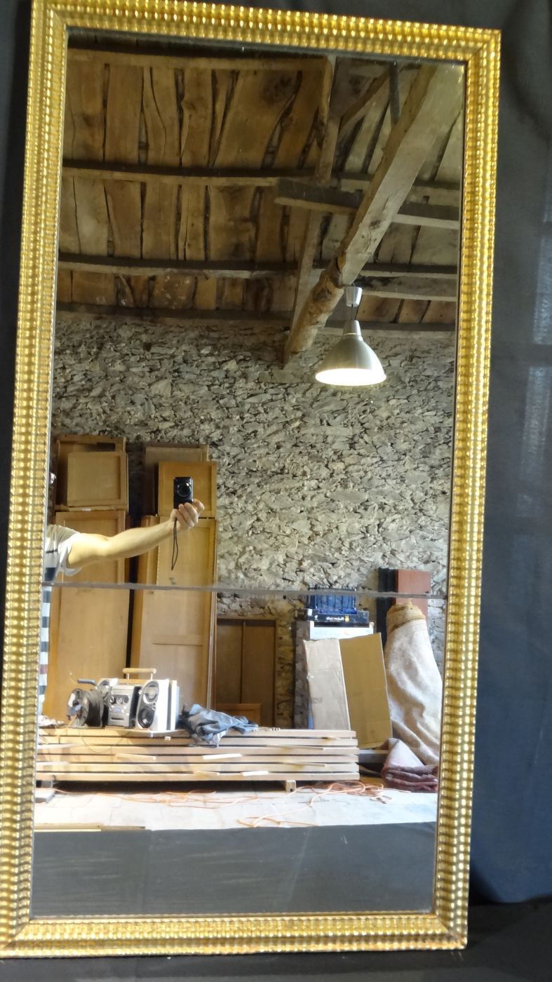 Gilded stucco mirror with gold leaf, H 152 cm