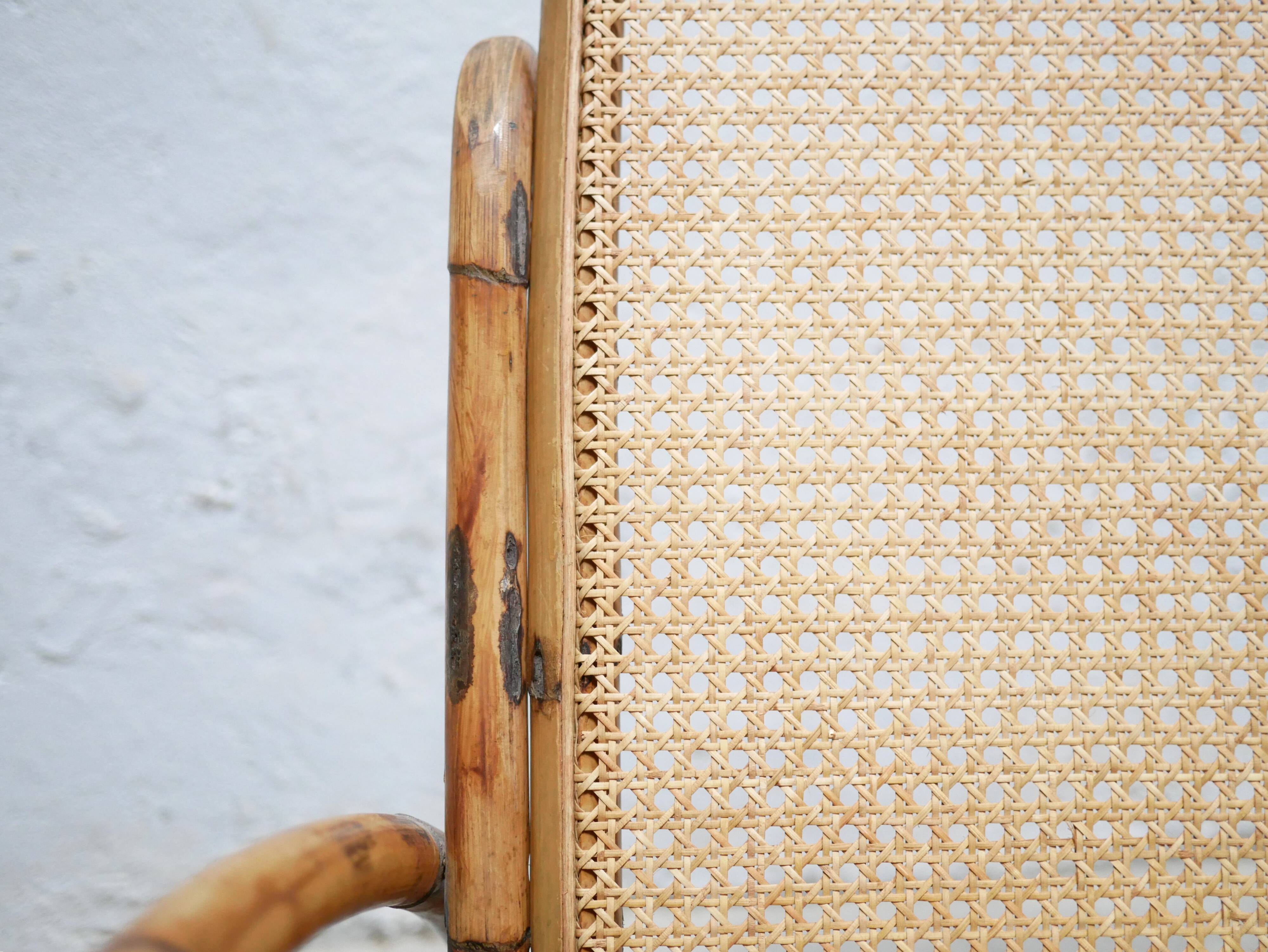 Fauteuil à bascule vintage en rotin et cannage