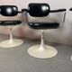 A striking set of four vintage swivel dining chairs