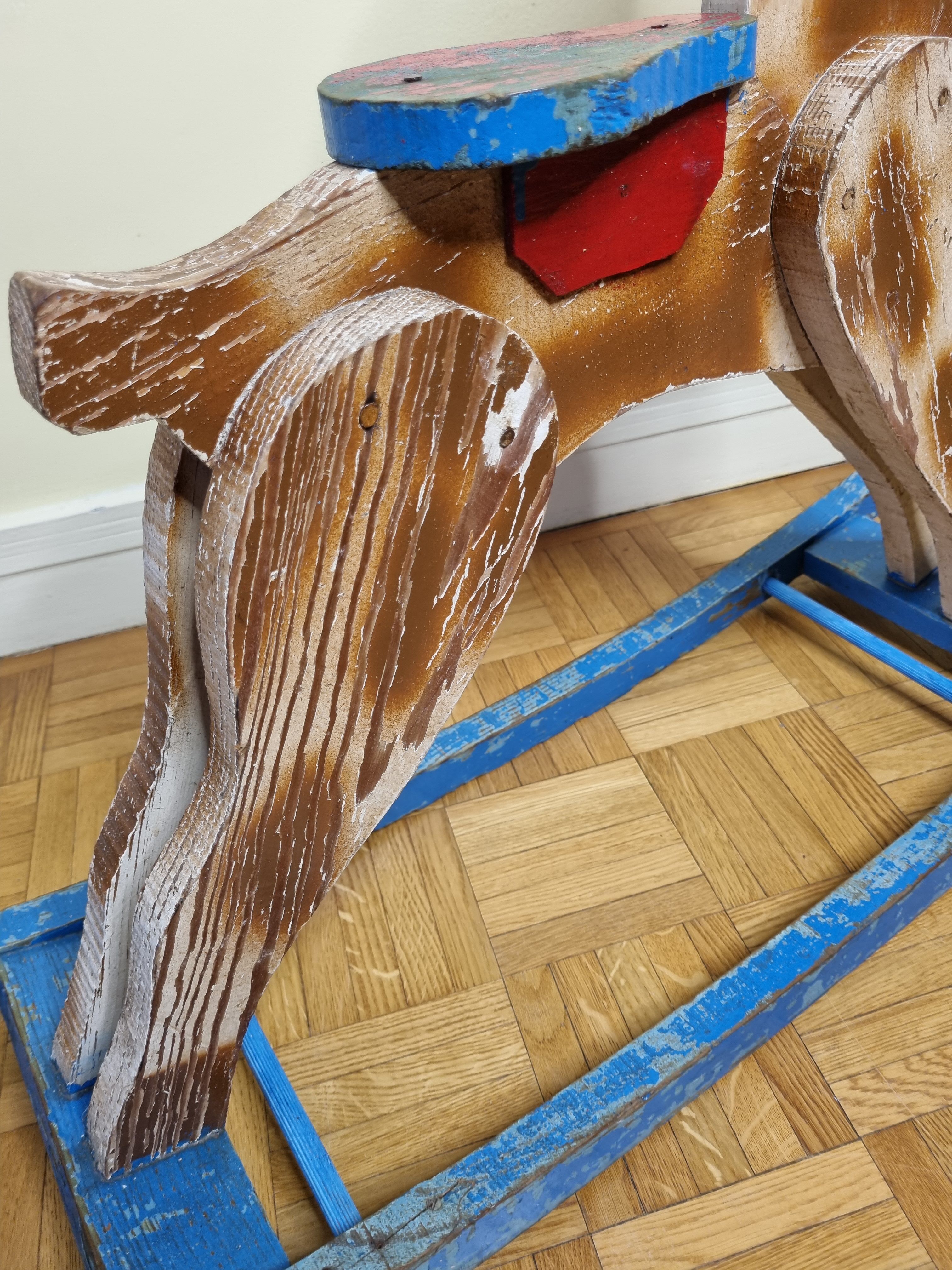 Old rocking horse in painted wood, 50s