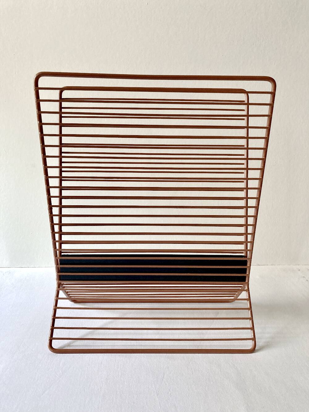 Wire metal magazine rack with triangular compartment, 1950s.