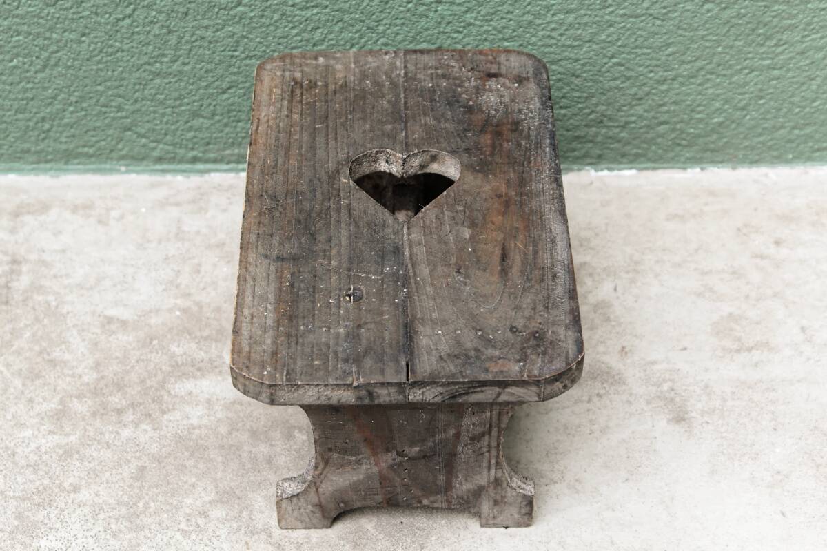 Wooden footrest, heart cutout