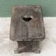 Wooden footrest, heart cutout