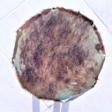 Rustic tripod stool seat covered with goatskin