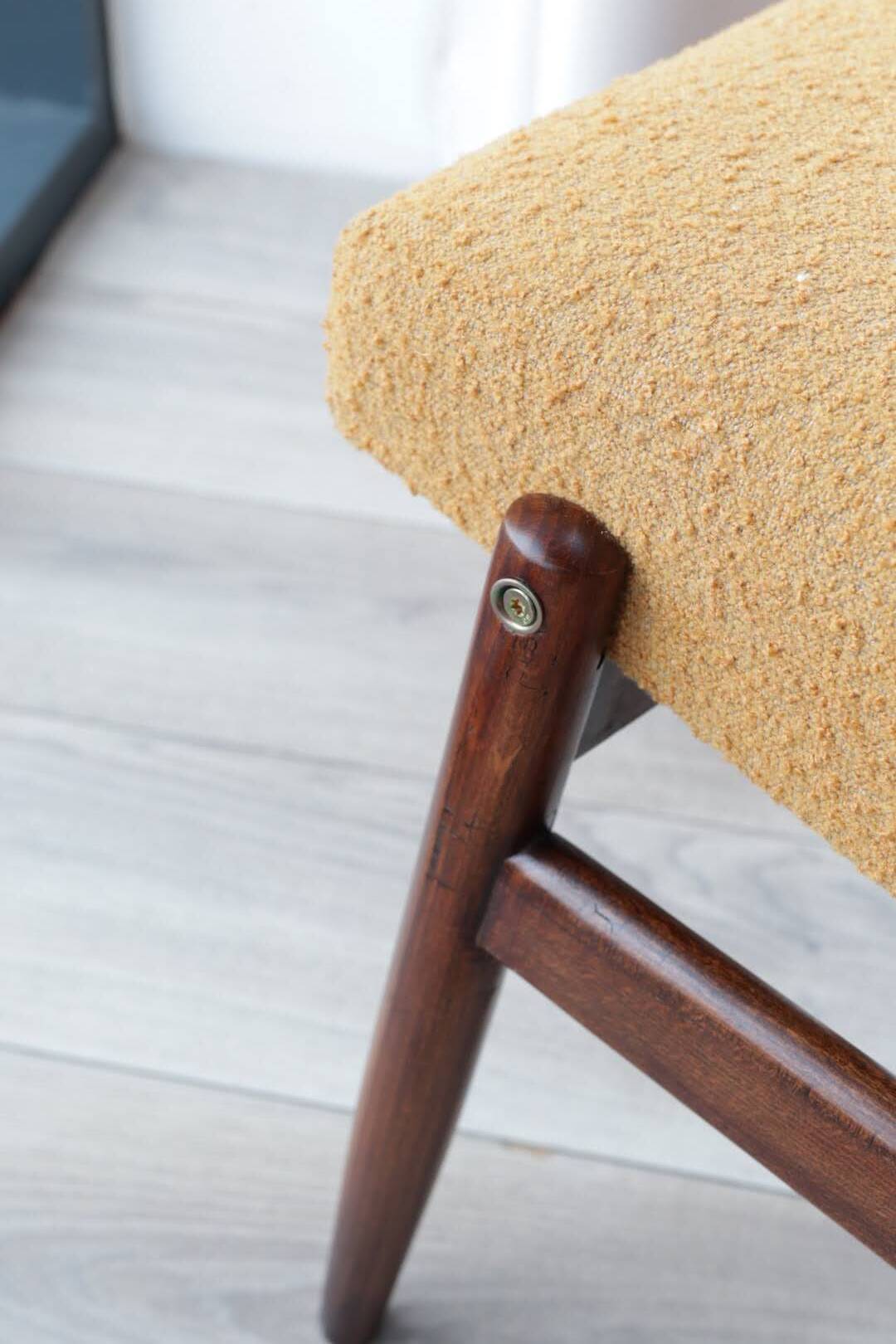 Yellow vintage lounge chair armrests boucle upholstery, walnut wood, Scandi