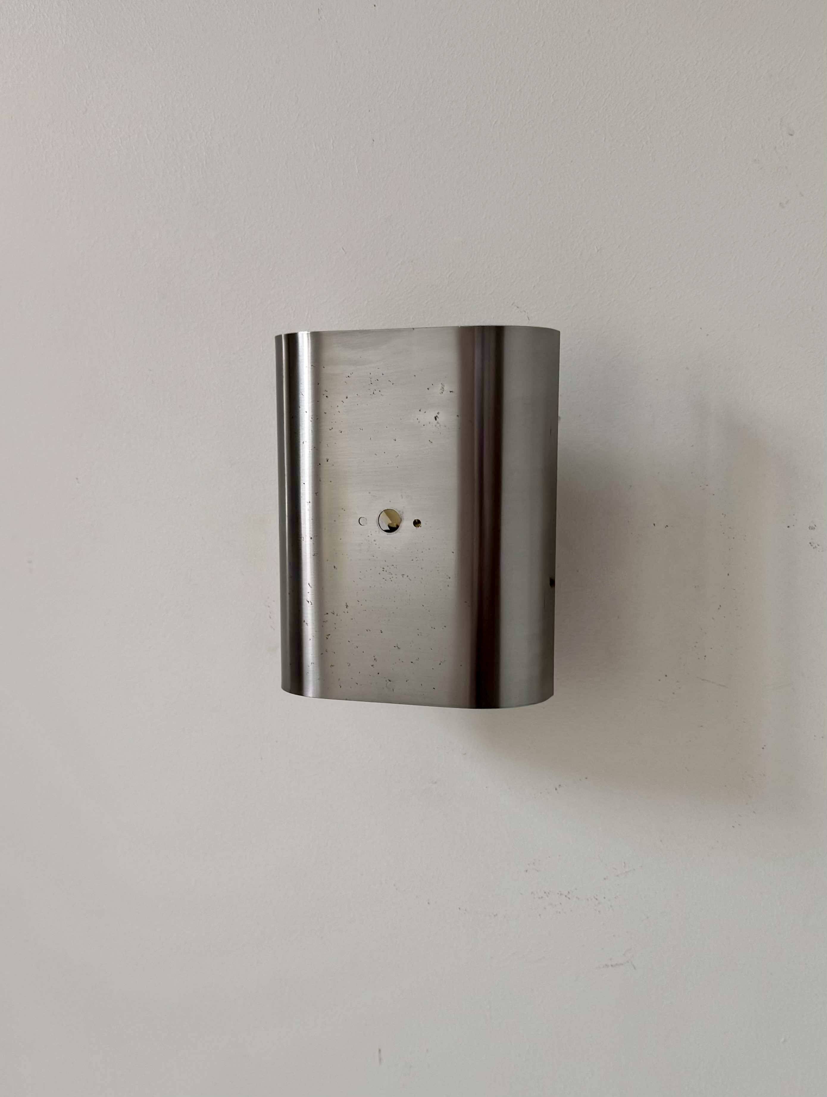 Vintage curved brushed metal wall light, France 1970