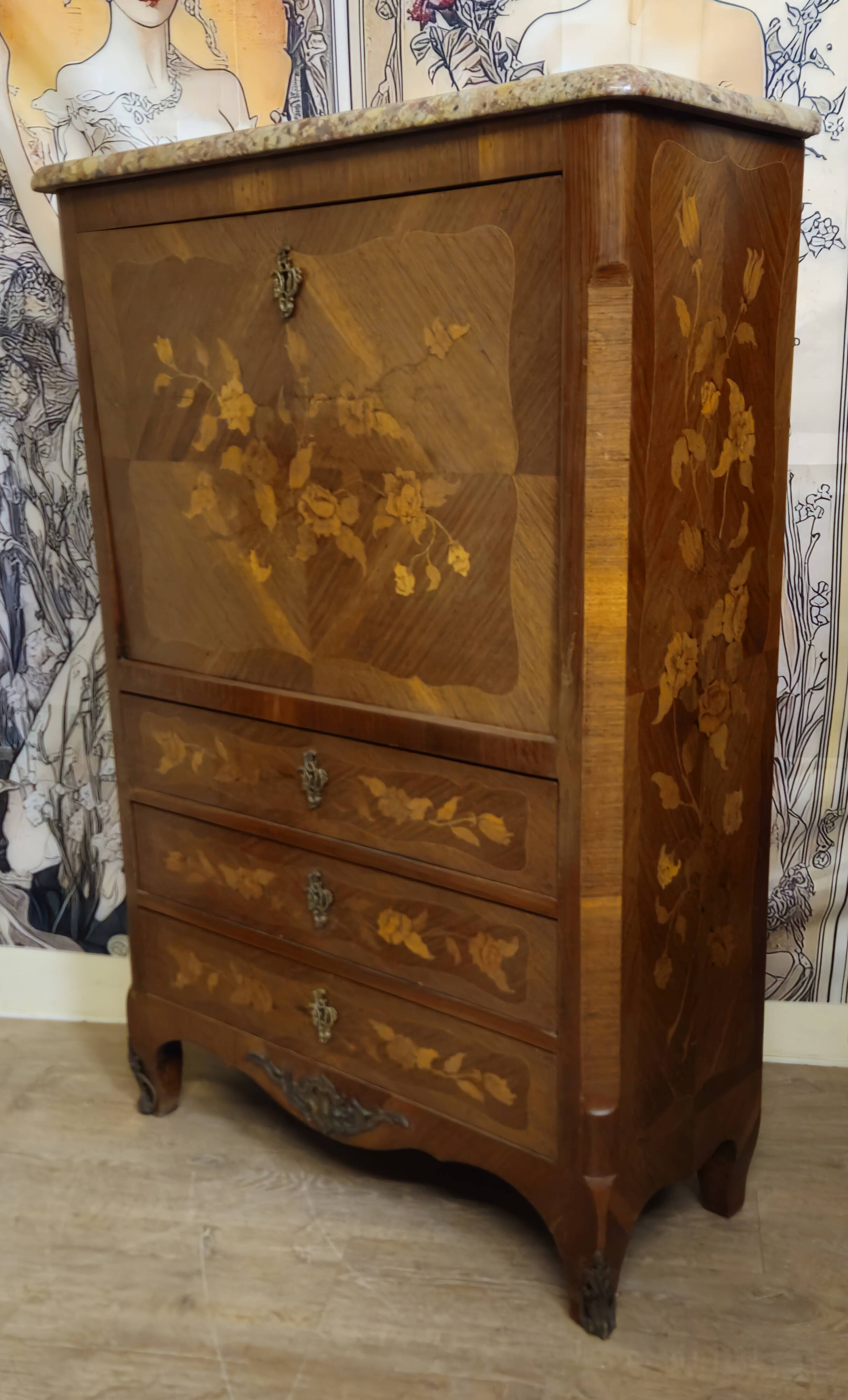 Secretary with a curved drop-leaf in floral marquetry, mid-19th century.