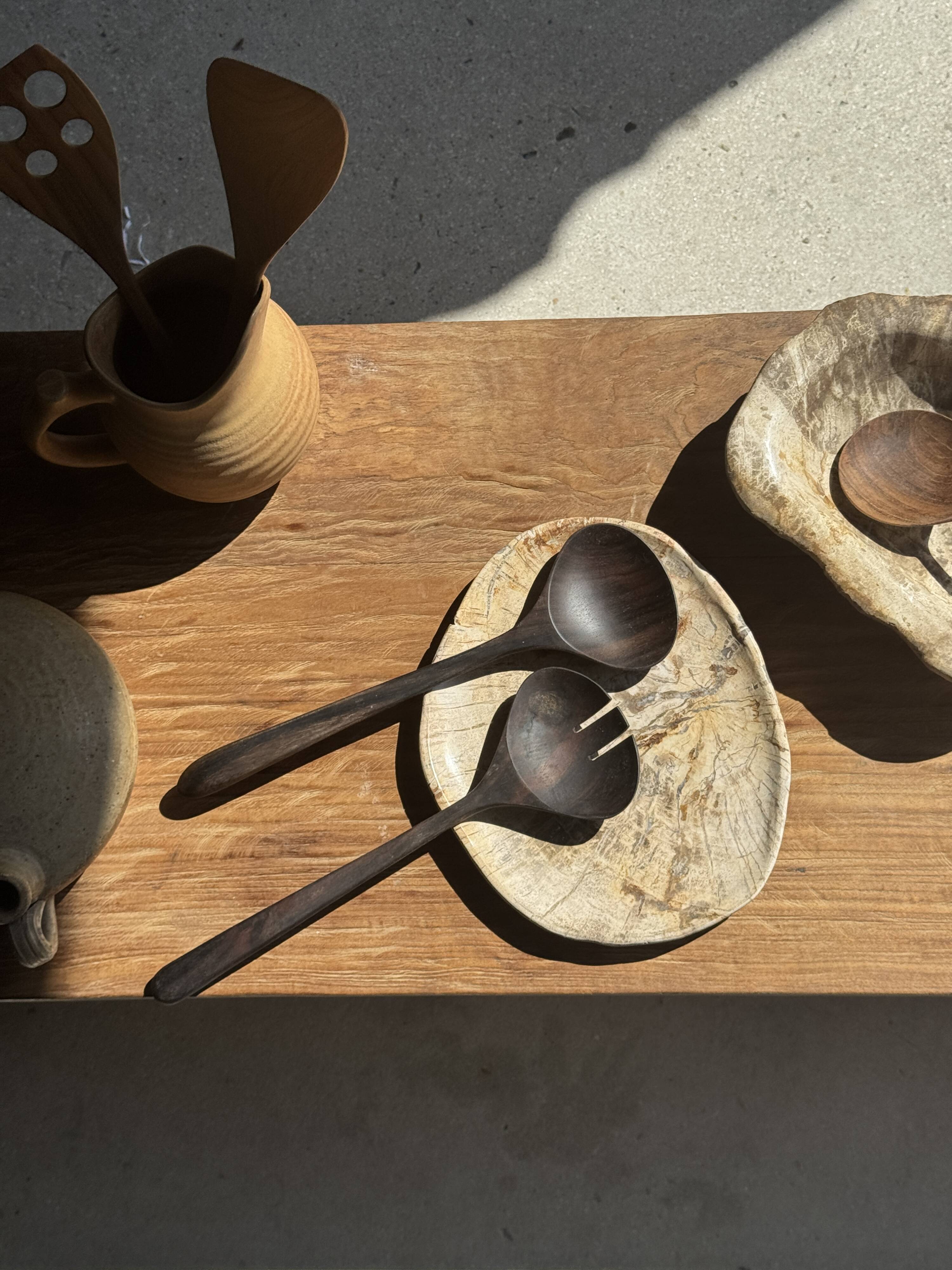 Pair of salad servers or kitchen utensils in blackened teak L30 D9