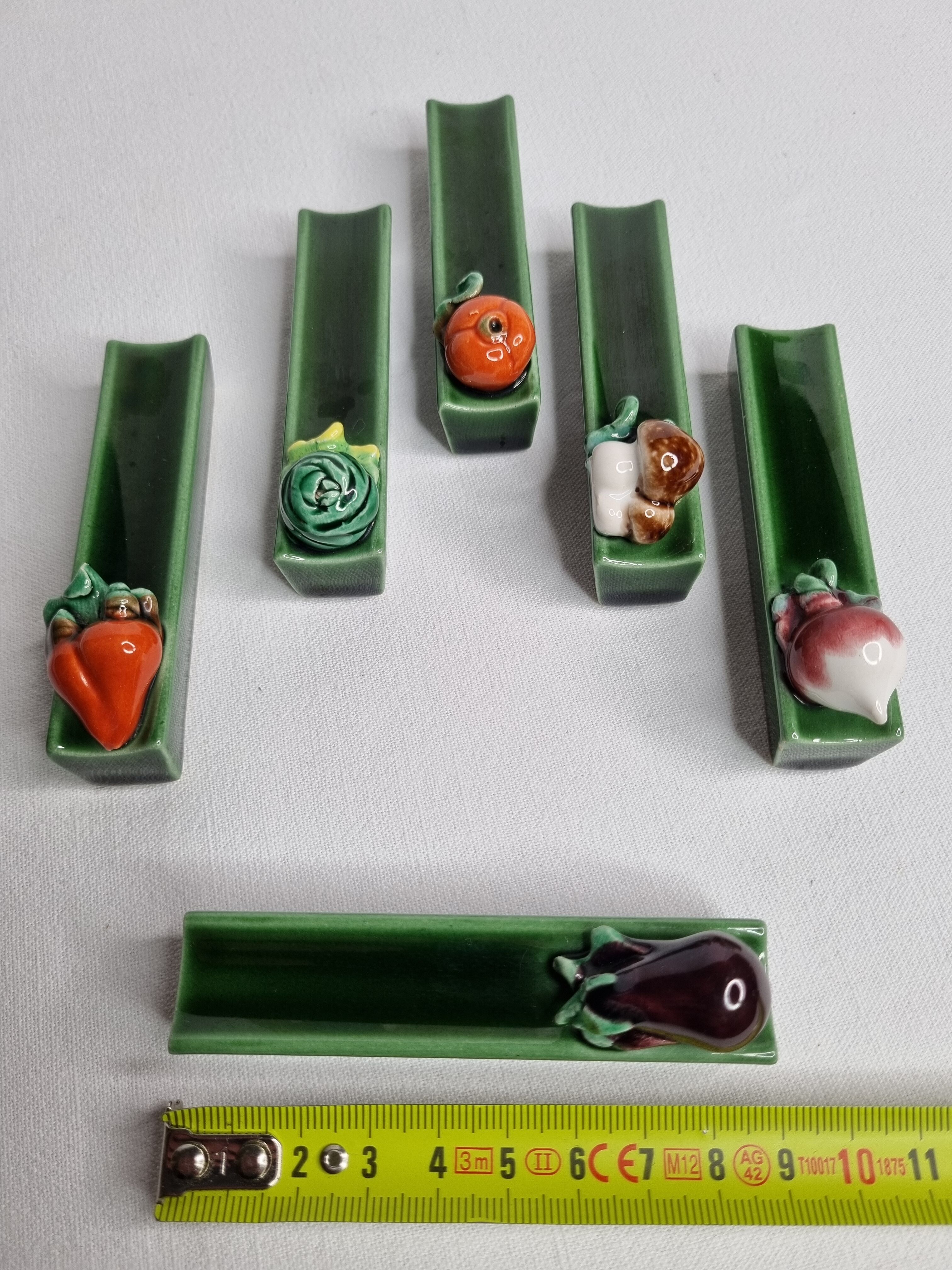 Set of six enamelled ceramic knife holders decorated with vegetables from the sun