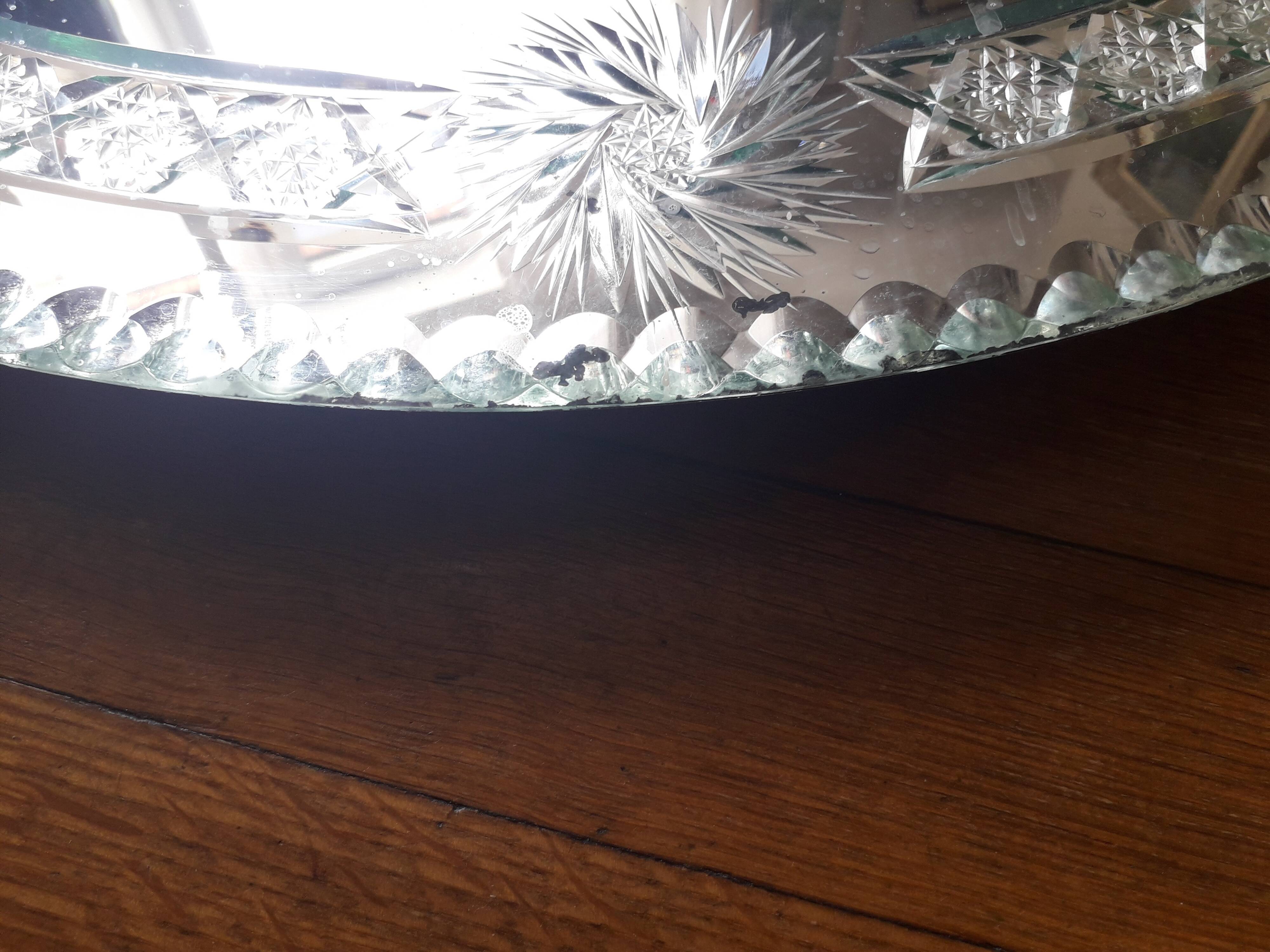 Large old round mirror finely decorated