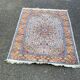 Handmade Persian rug in blue, beige, burgundy, and orange, 95x160cm.