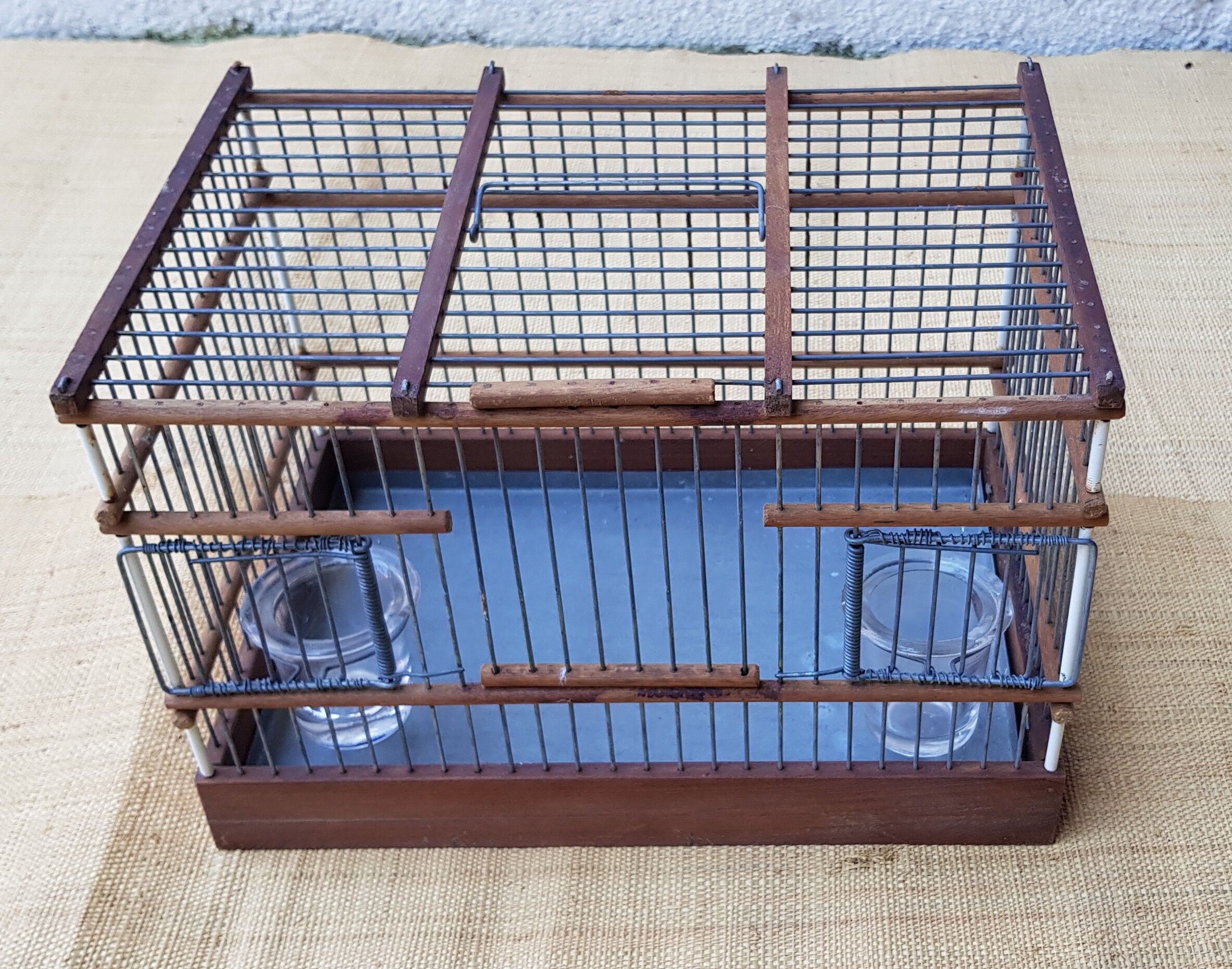 Birdcage with glass trough