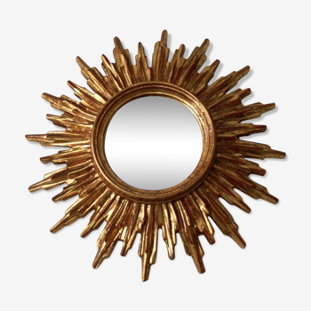 Golden carved wood sun mirror