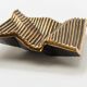 Brutalist bronze pocket emptier