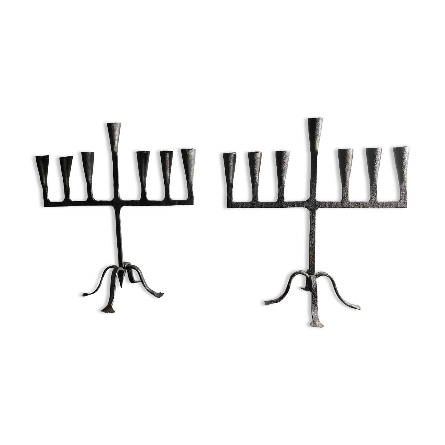 Pair of beaten iron candlesticks