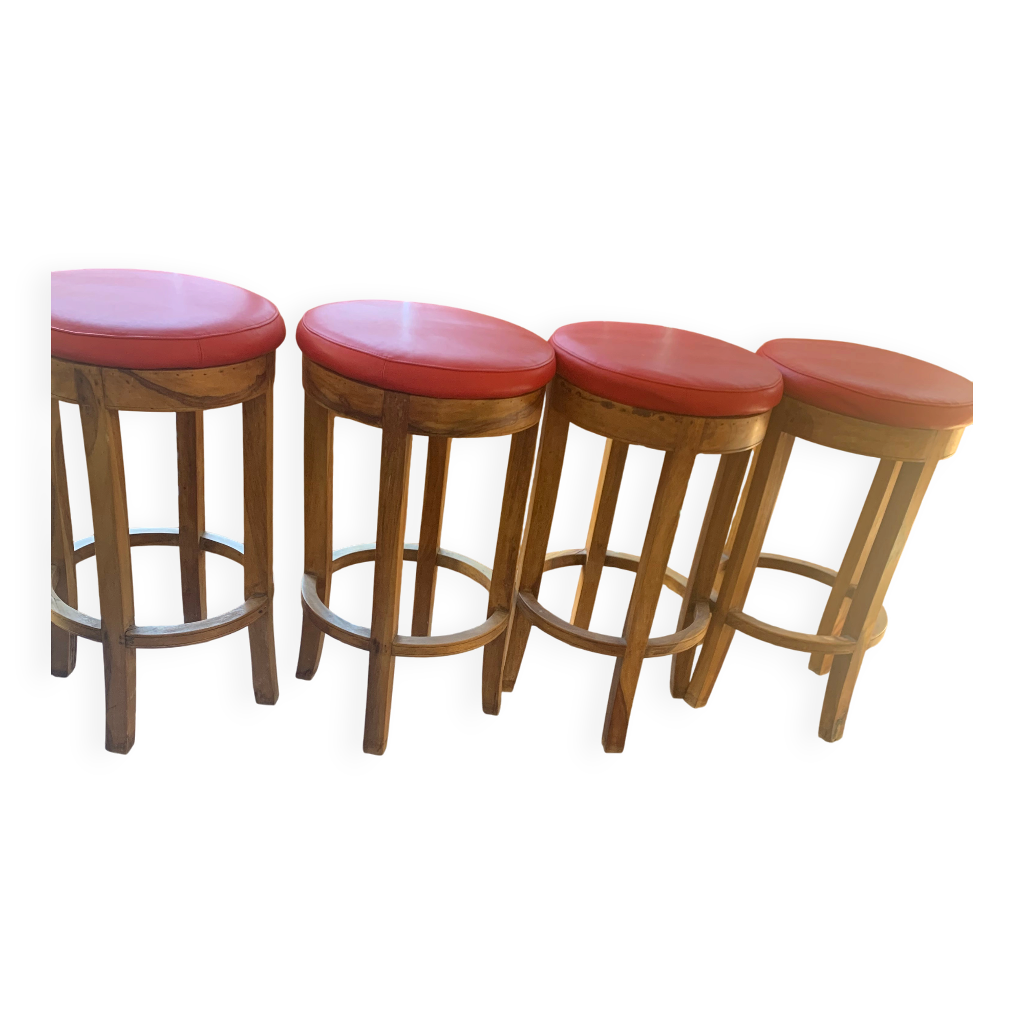 Set of 4 bar stools in solid exotic wood and red leather.