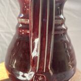 Oxblood pitcher with grotesque mask in the Delplera spirit