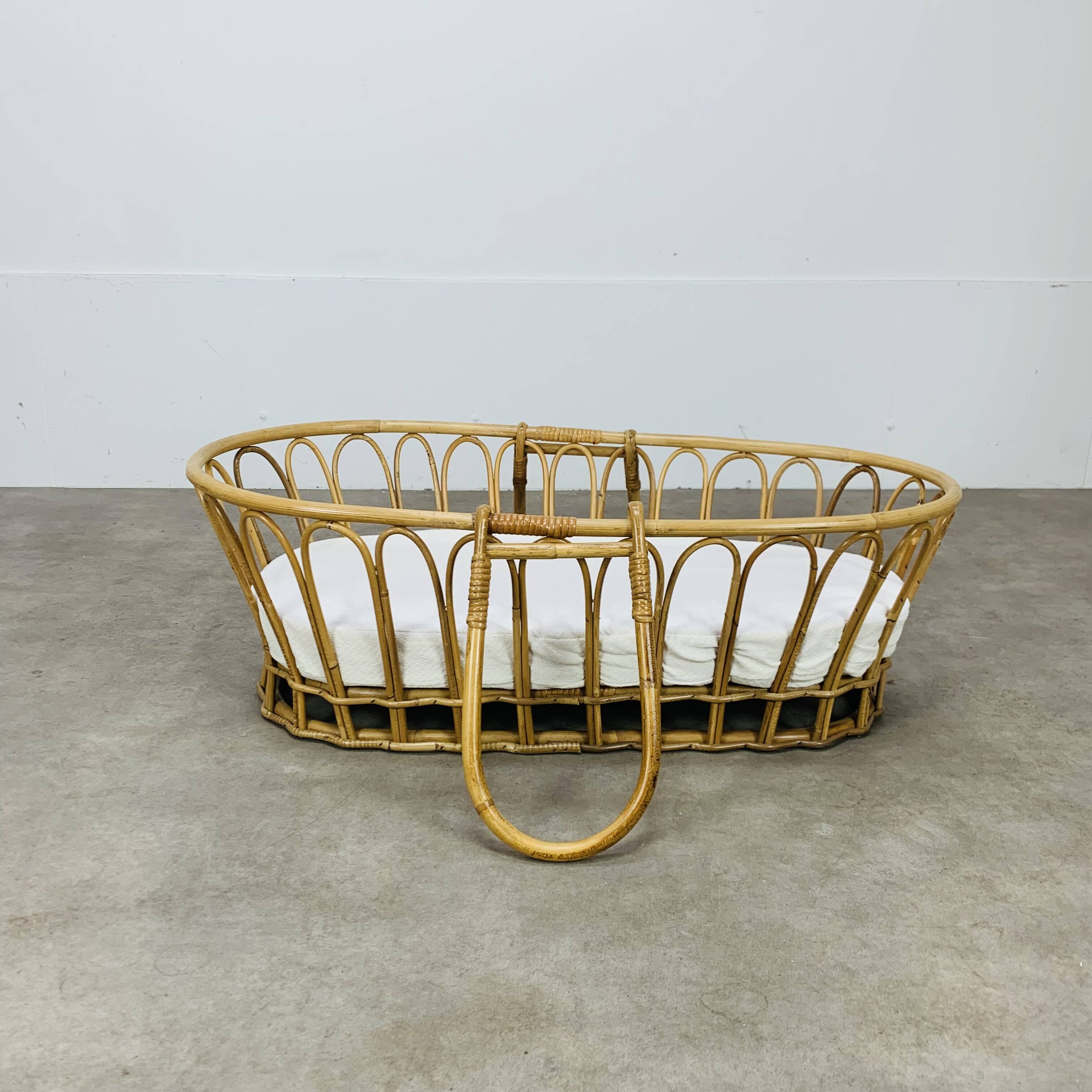 Vintage rattan baby bassinet