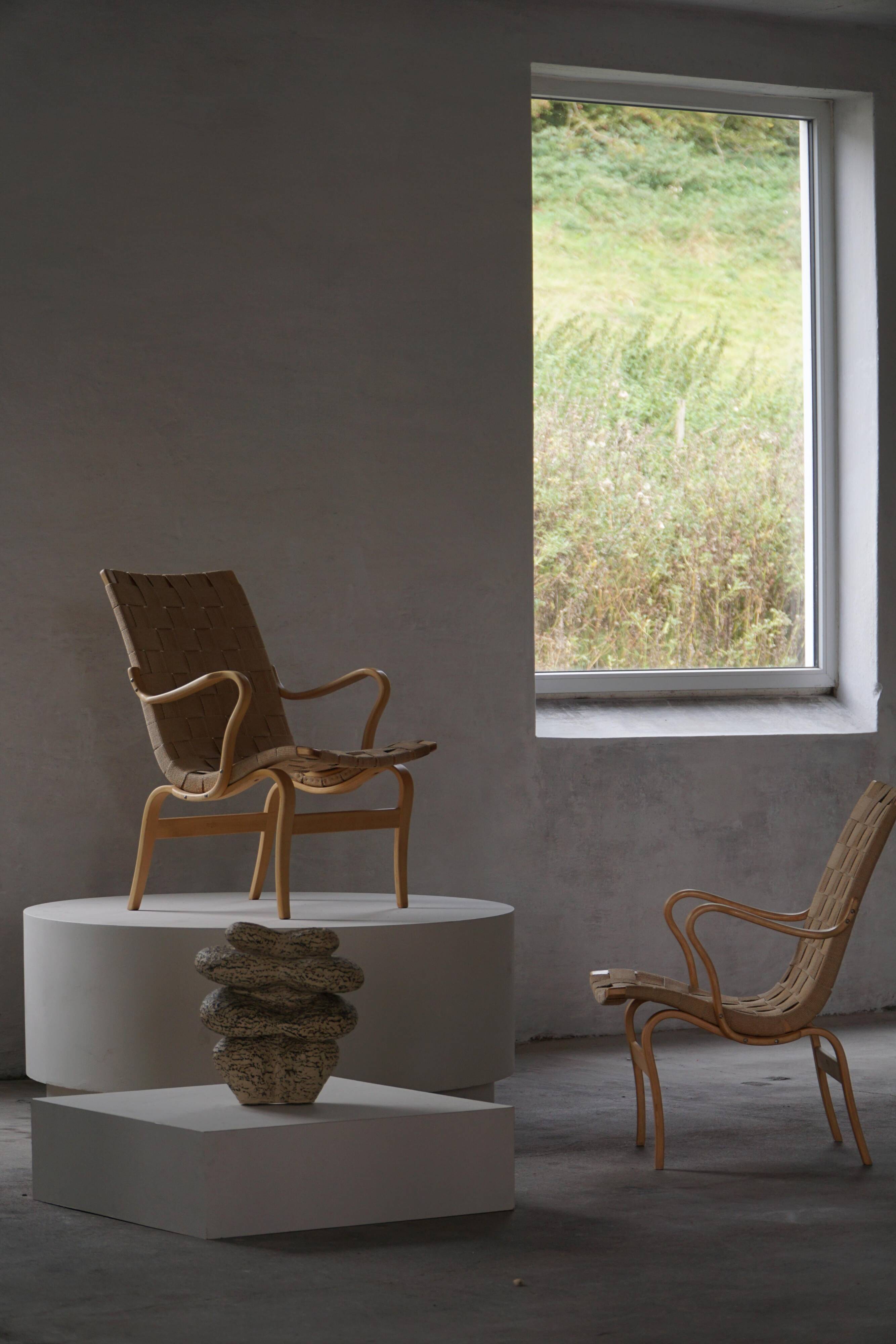 Pair of Swedish armchairs from the mid-century by Bruno Mathsson, model "Eva", 1960s.