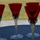 5 red crystal glasses with twisted stems
