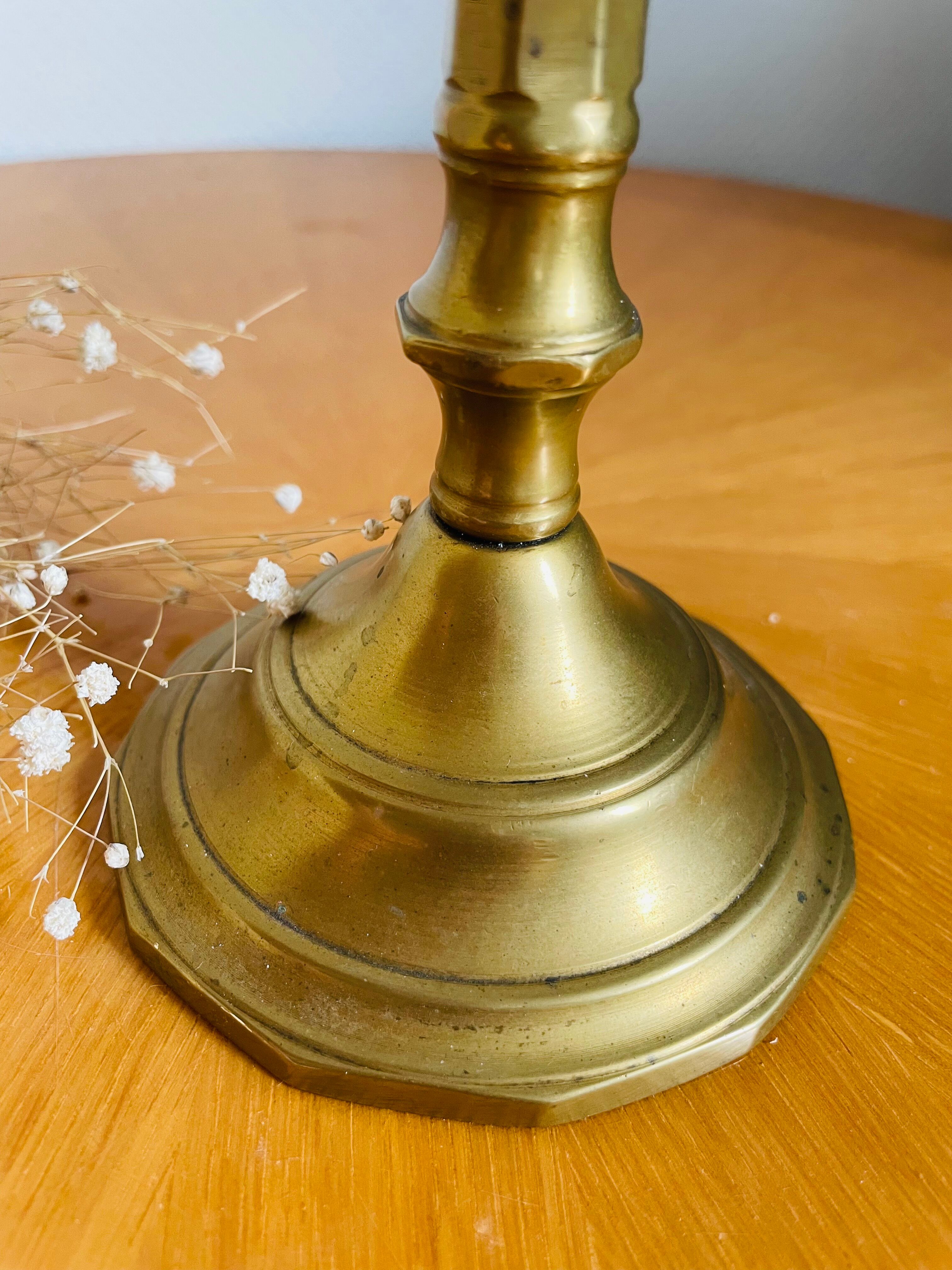 Old brass torch candle holder
