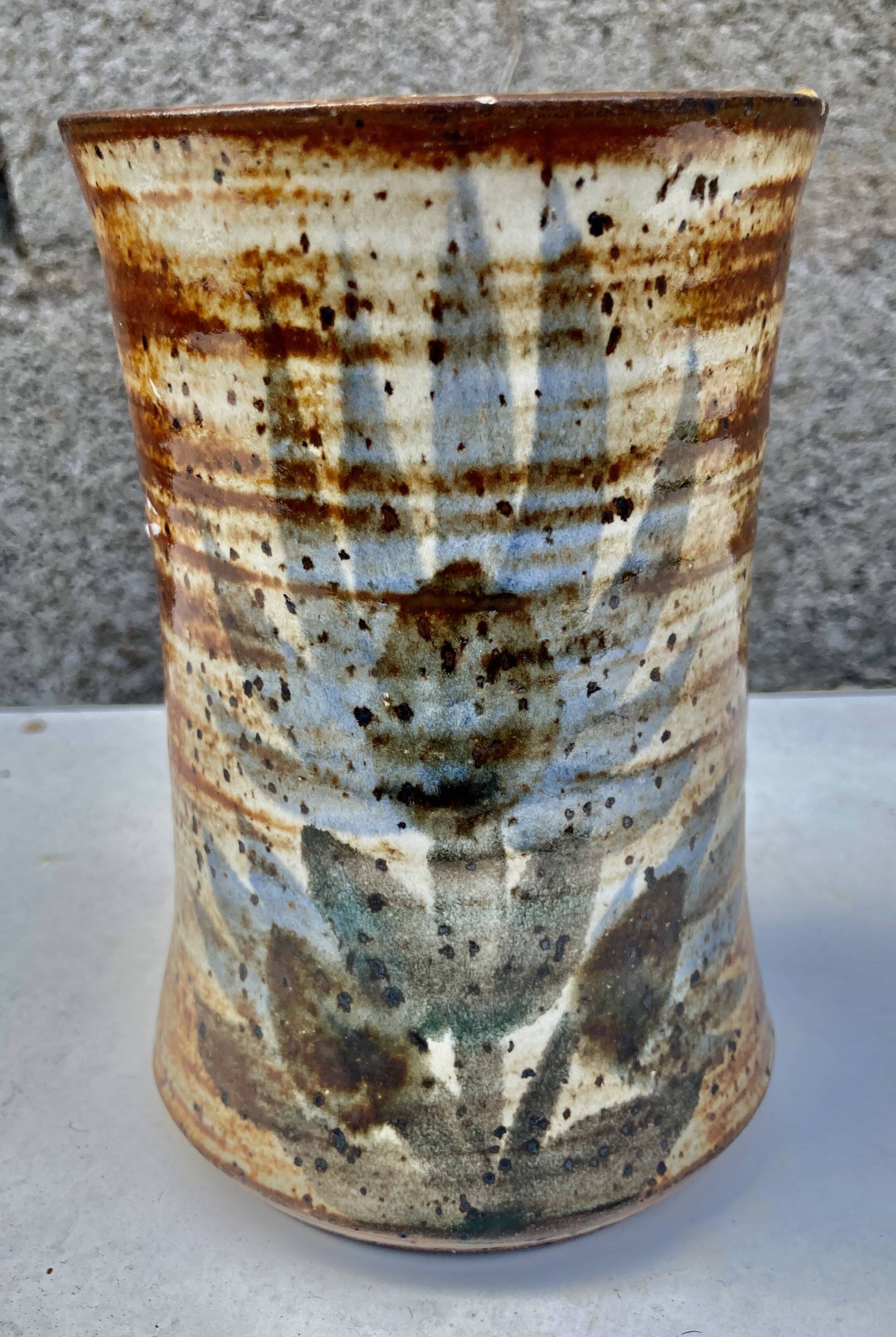 glazed ceramic vase with abstract flower decoration, signature to identify