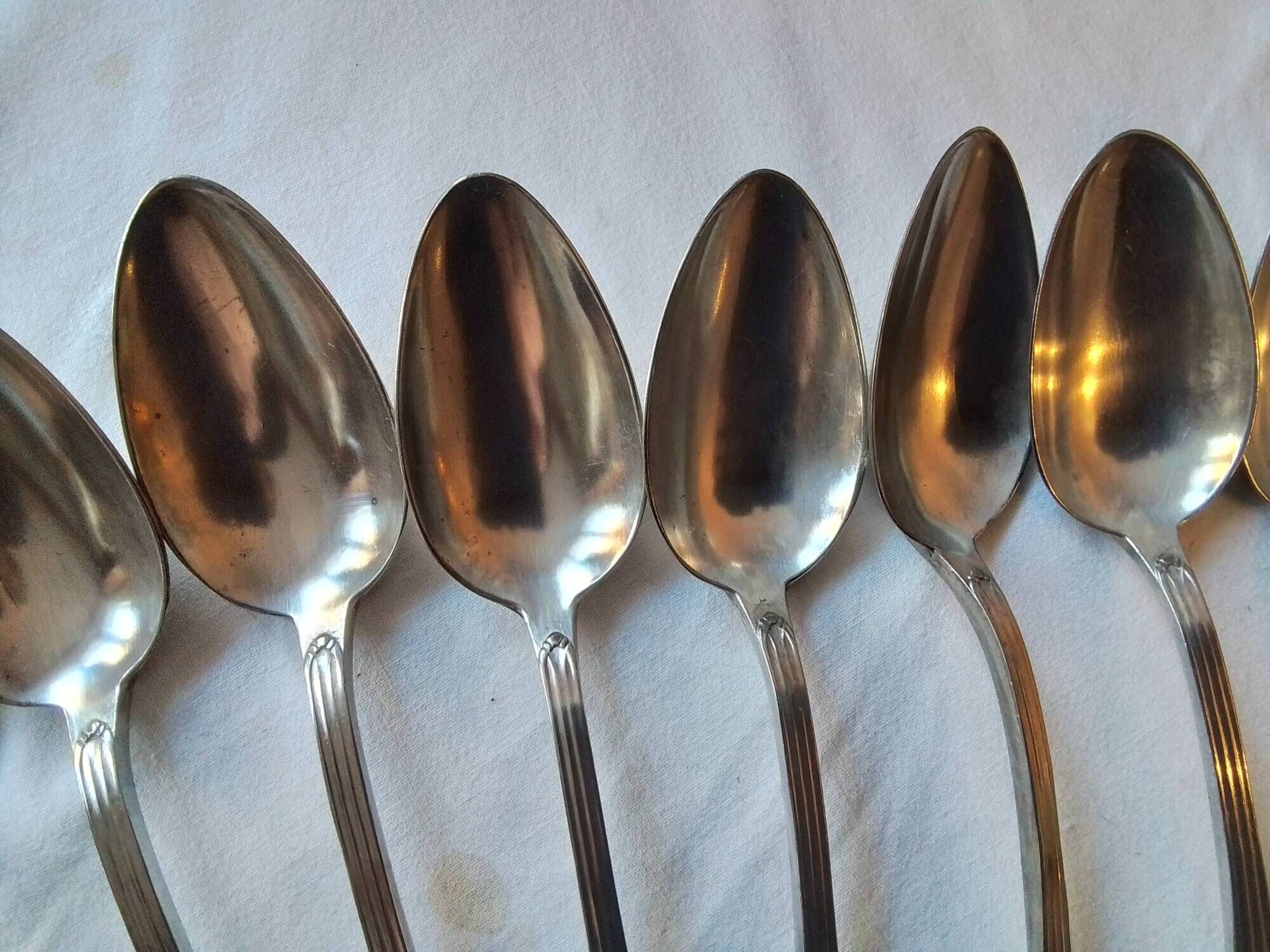 12 Art Deco forks and 12 Bouillet Bourdelle soup spoons.