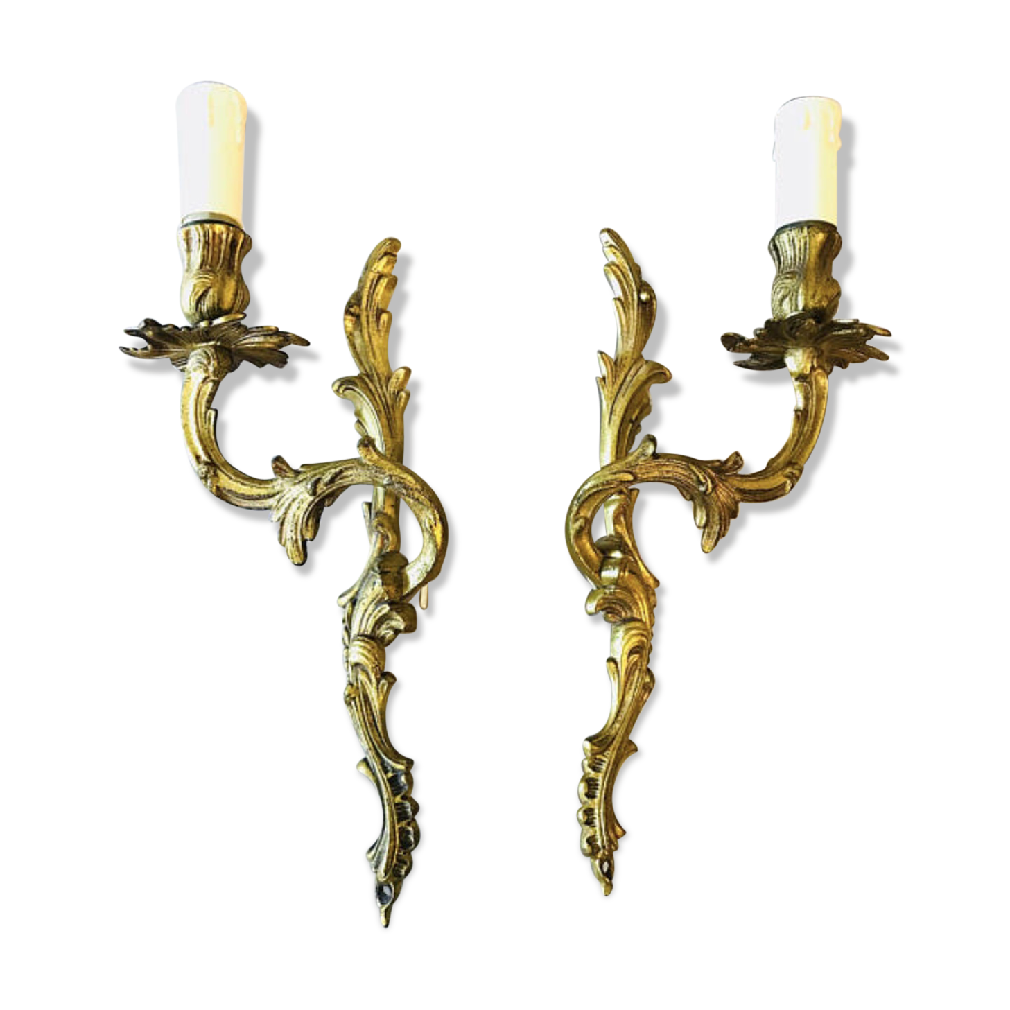 A pair of rococo gilded wall lights