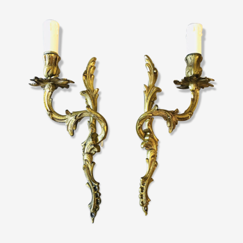 A pair of rococo gilded wall lights