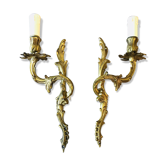 A pair of rococo gilded wall lights