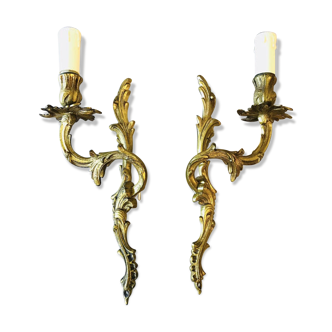 A pair of rococo gilded wall lights