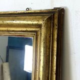 19th century mercury mirror with wooden frame and gilded stucco